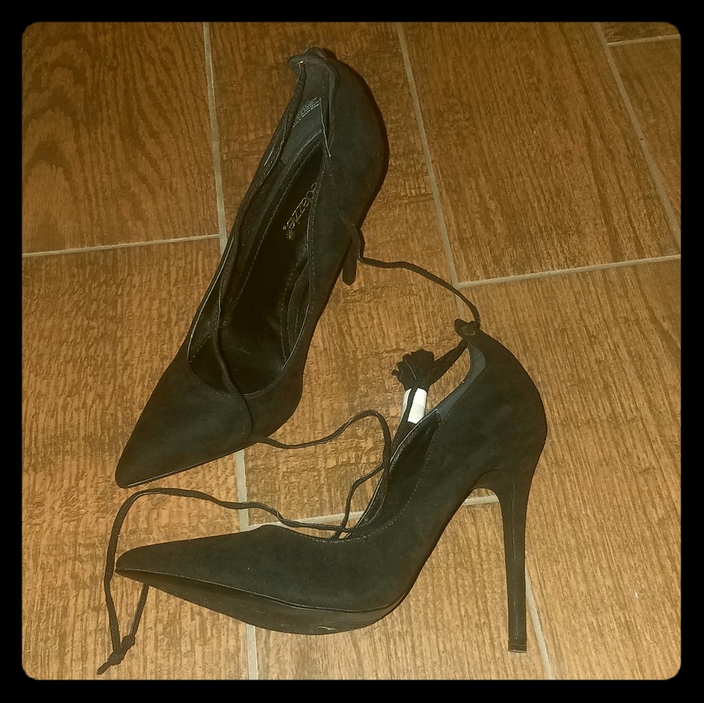 Laced up pointed toed black high heels
